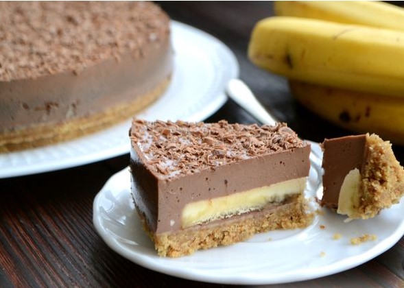 A piece of banana chocolate mousse cake Stock Photo by AntAlexStudio
