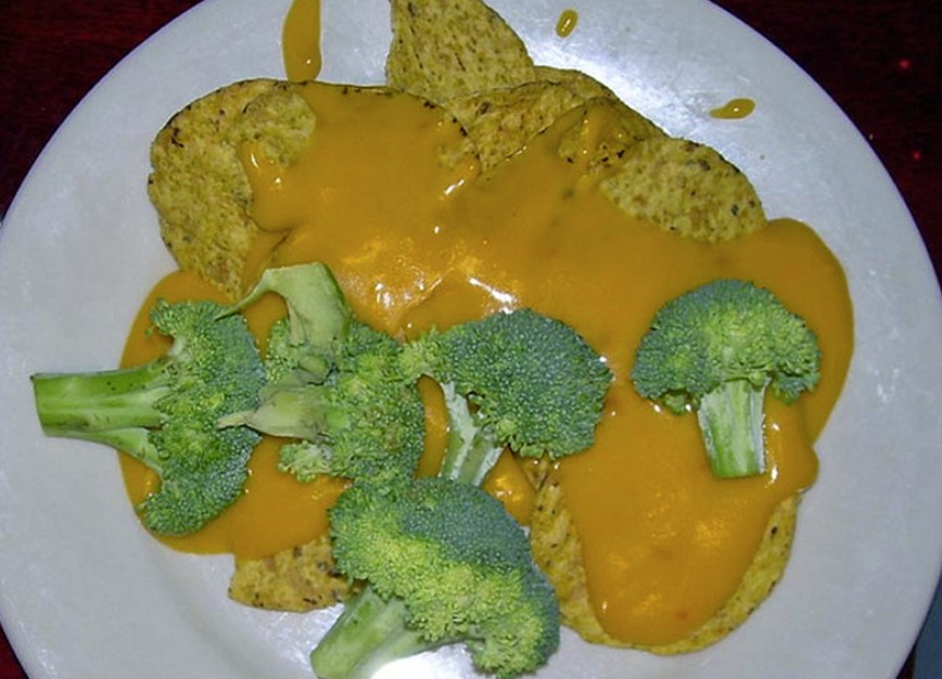 Fresh broccoli, chips, and sauce.