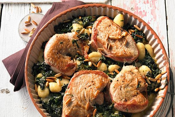 Baked Turkey Steaks with Spinach Gorgonzola Sauce and Pine Nuts