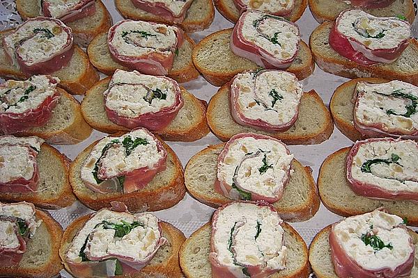 Parma Ham Rolls with Cream Cheese and Basil on Toasted Bread Slices