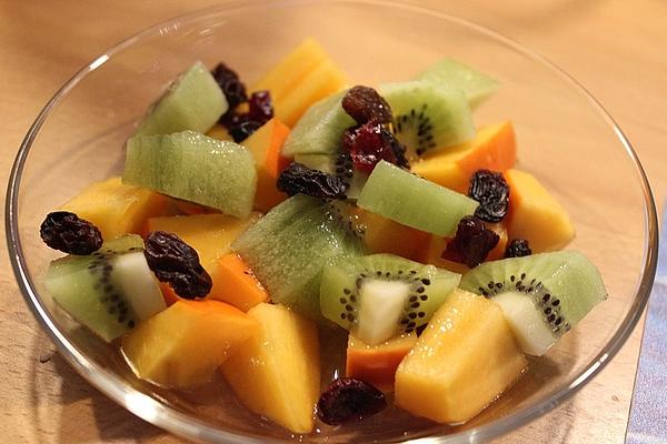 Persimmon and Kiwi Salad in Orange Sauce and Pieces Of Dates