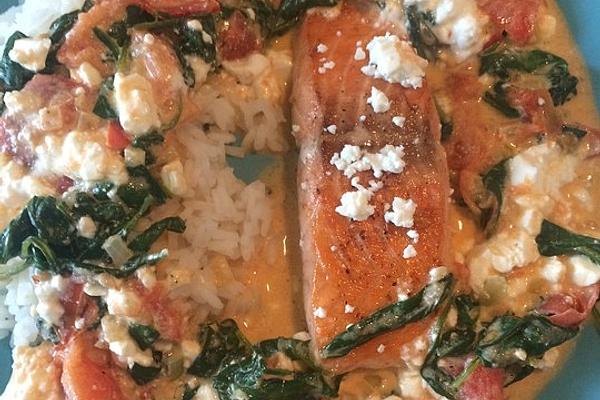 Salmon Fillet on Tomato and Spinach Sauce As Well As Feta and Rice