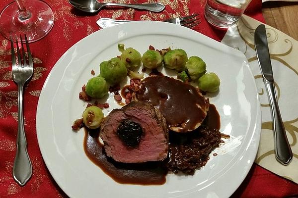 Stuffed Beef Fillet with Prunes on Red Wine Gingerbread Sauce with Mini Dumplings and Brussels Sprouts