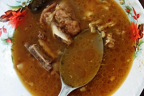Exotically Spicy Goat Soup, Which Is Served with Rice