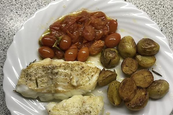 Fish Fillet `Mediterranean` with Potatoes, Tomatoes, Olive Oil and Garlic