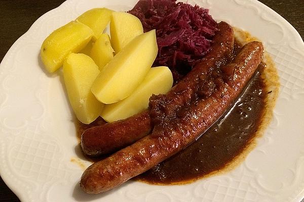 Fresh Sausage in Apple and Malt Beer Sauce with Potatoes and Red Cabbage