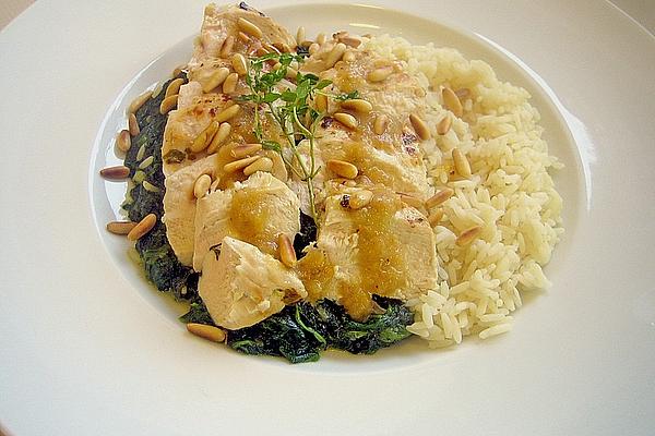 Fried Chicken Breast on Spinach Leaves with Lemon Sauce