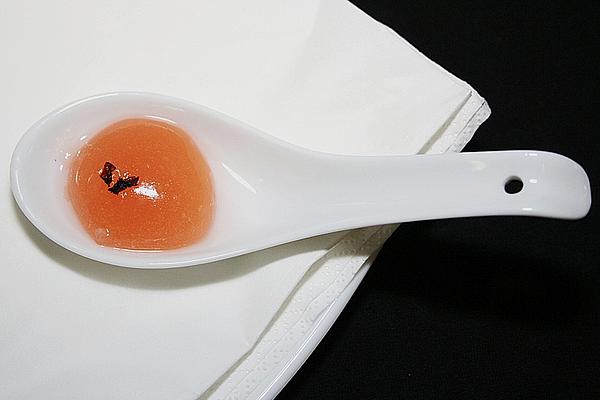 Gel Capsules Made from Clear Tomato Bouillon with Fried Basil