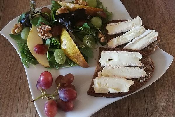 Grape Salad with Nuts and Pears on Toasted Bread Slices with Camembert