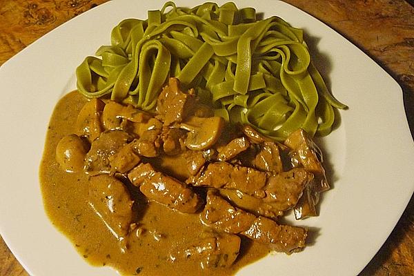 Green Ribbon Noodles with Pork Fillet in Creamy Mushroom Sauce