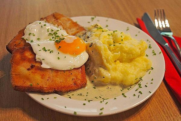 Maurerschnitzel – Fried Meat Loaf with Fried Egg, Mashed Potatoes and Herb-cream Sauce