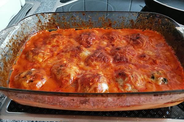 Meatballs Filled with Feta Cheese Baked in Tomato Sauce