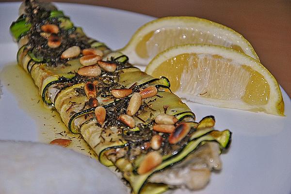 Pikeperch Fillet Wrapped in Zucchini with Pine Nuts