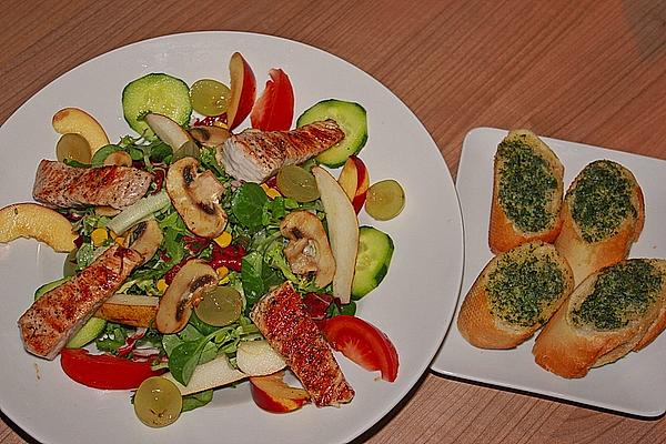 Salad with Strips Of Turkey and Herb Butter Baguette