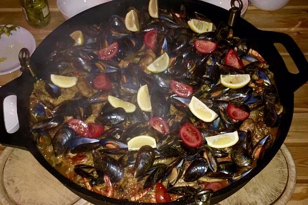 Seafood – Paella on Grill Over Charcoal