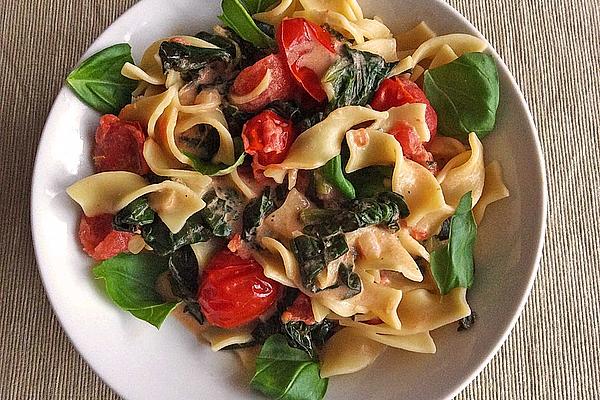 Tagliatelle in Lemon Sauce with Spinach Leaves and Tomatoes