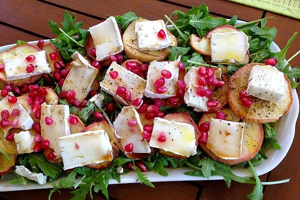 Trio Of Goat Cheese, Honey Apple and Pomegranate on Bed Of Rocket