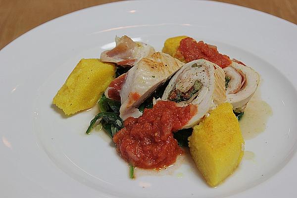 Turkey Involtini on Spinach Leaves with Polenta Slices and Tomato Sauce