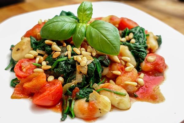 Vegan Gnocchi in Tomato Sauce with Fresh Spinach Leaves