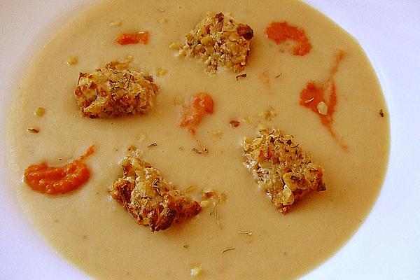White Bean Cream Soup with Walnut Toast Cubes and Paprika Cream