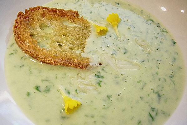 Wild Garlic Soup with Macadamia Nuts, Bread Chips and Primrose Flowers