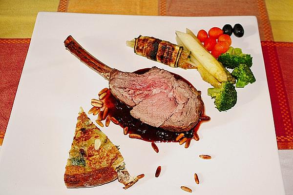 Loin Of Veal in Salt Crust with Olive and Red Wine Sauce with Young Vegetables